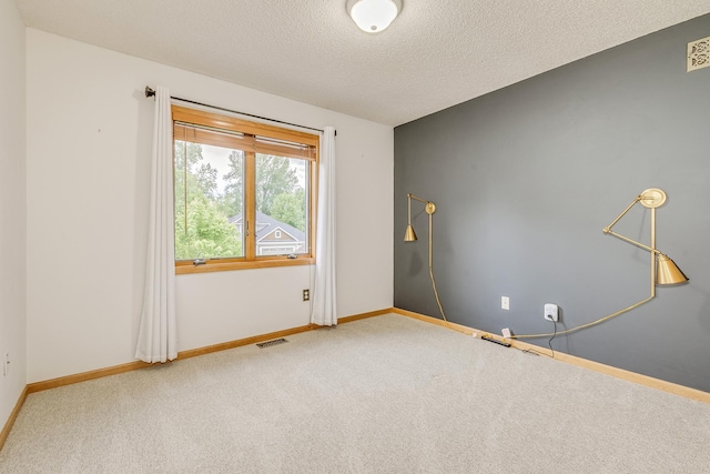1469 Sherman Lake Rd, Lino Lakes, MN 55038 - spare room with carpet, a textured ceiling, and baseboards