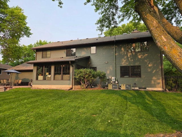 1410 16th St SW, Willmar, MN 56201 - rear view of house with a yard and a patio