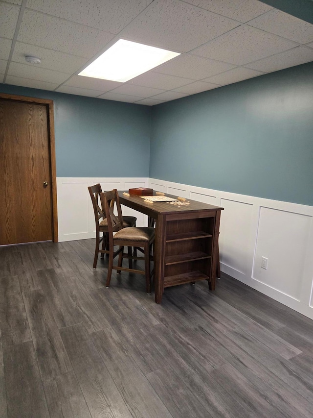 1410 16th St SW, Willmar, MN 56201 - dining space with wainscoting, a drop ceiling, dark wood finished floors, and a decorative wall