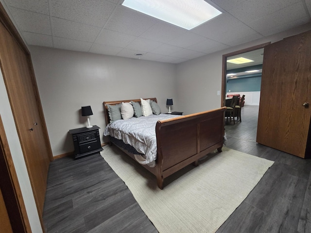 1410 16th St SW, Willmar, MN 56201 - bedroom featuring a drop ceiling and dark wood-style floors