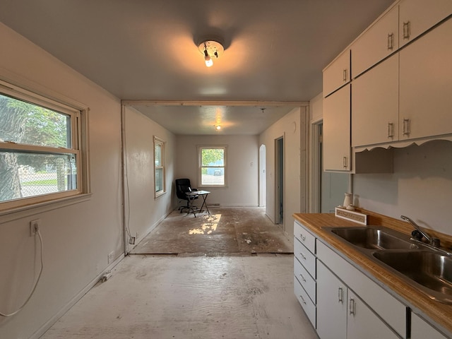 139 Petrick St, Appleton, MN 56208 - kitchen featuring a sink and white cabinetry