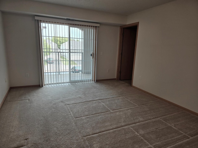 15631 Linnet St NW Unit 3-208, Andover, MN 55304 - carpeted spare room with baseboards
