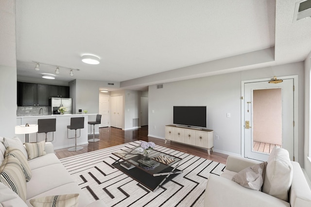 615 1st St Unit 405, Minneapolis, MN 55401 - living area with dark wood finished floors and baseboards
