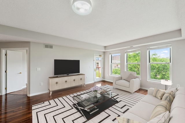 615 1st St Unit 405, Minneapolis, MN 55401 - living area with wood finished floors, baseboards, and a textured ceiling