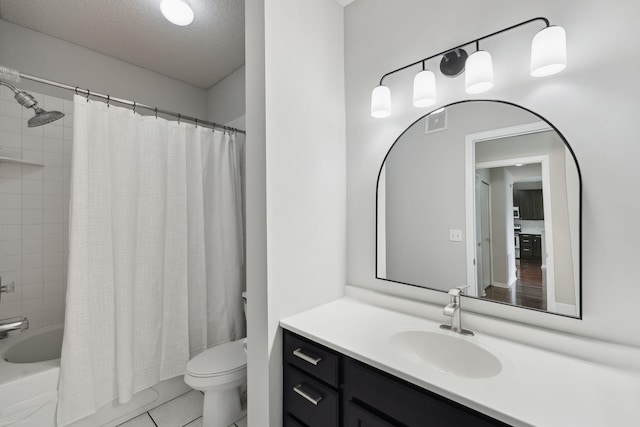 615 1st St Unit 405, Minneapolis, MN 55401 - bathroom with toilet, vanity, shower / tub combo, tile patterned flooring, and a textured ceiling