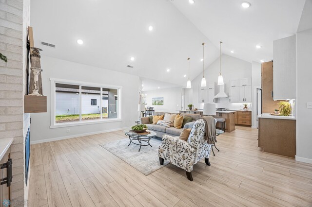 4295 Bristlecone Loop S, Fargo, ND 58104 - living room featuring high vaulted ceiling, light wood-style floors, baseboards, and recessed lighting