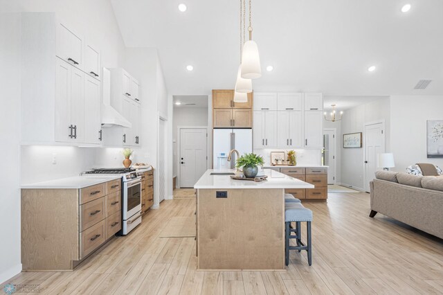 4295 Bristlecone Loop S, Fargo, ND 58104 - kitchen featuring white appliances, a sink, a center island with sink, a breakfast bar, and light countertops