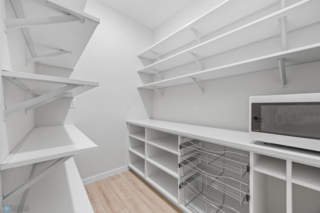 4295 Bristlecone Loop S, Fargo, ND 58104 - walk in closet with wood finished floors