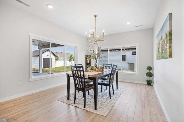 4295 Bristlecone Loop S, Fargo, ND 58104 - dining space featuring a chandelier, light wood-style floors, baseboards, and recessed lighting