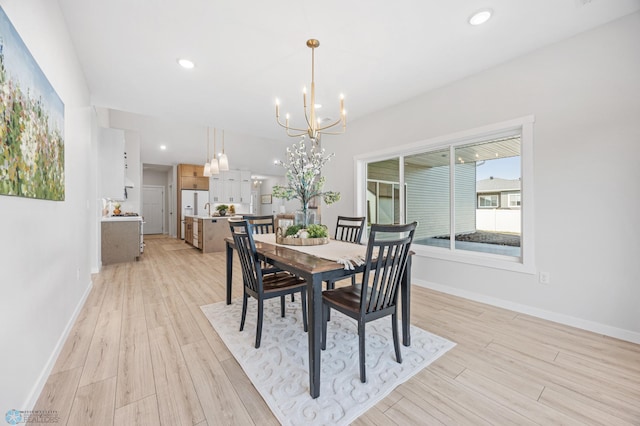 4295 Bristlecone Loop S, Fargo, ND 58104 - dining room featuring a chandelier, light wood-style floors, baseboards, and recessed lighting