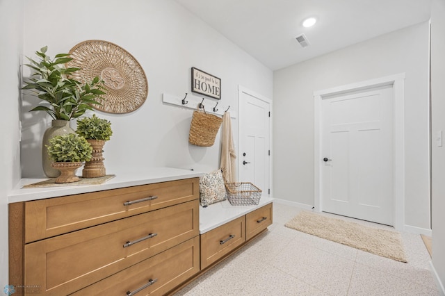 4295 Bristlecone Loop S, Fargo, ND 58104 - mudroom featuring baseboards and dark aggregate flooring