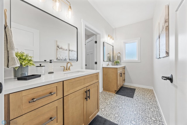 4295 Bristlecone Loop S, Fargo, ND 58104 - full bath featuring baseboards, two vanities, and tile patterned floors