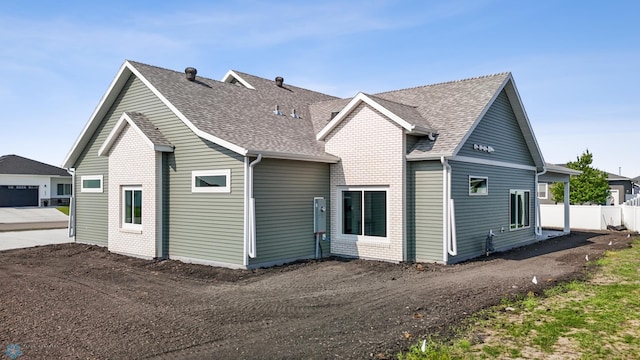 4295 Bristlecone Loop S, Fargo, ND 58104 - rear view of house with a shingled roof