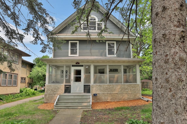 1807 Minnehaha Ave W, Saint Paul, MN 55104 - american foursquare style home featuring a sunroom