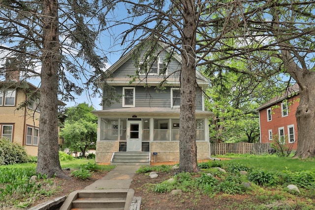 1807 Minnehaha Ave W, Saint Paul, MN 55104 - american foursquare style home featuring a sunroom