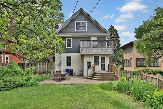 1807 Minnehaha Ave W, Saint Paul, MN 55104 - back of house with a balcony and a patio
