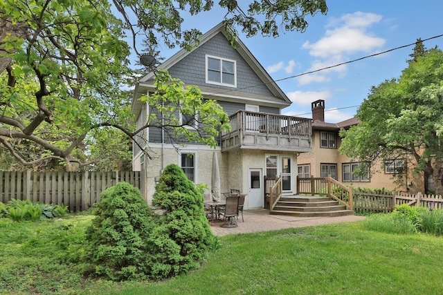 1807 Minnehaha Ave W, Saint Paul, MN 55104 - rear view of property with a balcony, a patio area, and stucco siding