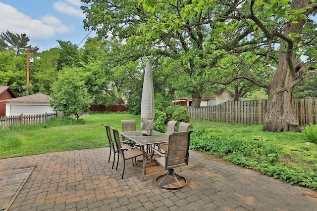 1807 Minnehaha Ave W, Saint Paul, MN 55104 - view of patio with outdoor dining area and a detached garage