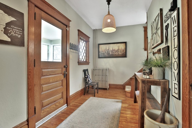 1807 Minnehaha Ave W, Saint Paul, MN 55104 - entrance foyer with radiator heating unit, light wood-type flooring, and baseboards