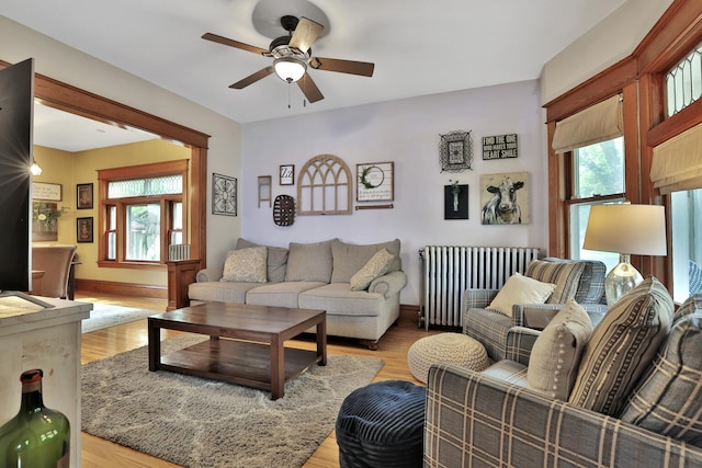 1807 Minnehaha Ave W, Saint Paul, MN 55104 - living area featuring radiator, a ceiling fan, light wood-type flooring, and baseboards