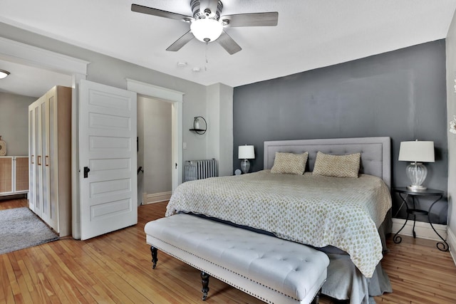 1807 Minnehaha Ave W, Saint Paul, MN 55104 - bedroom with radiator, wood finished floors, baseboards, and ceiling fan