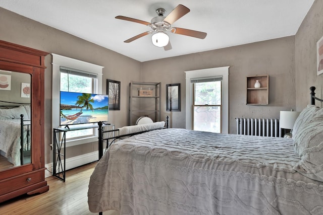 1807 Minnehaha Ave W, Saint Paul, MN 55104 - bedroom with radiator heating unit, wood finished floors, and a ceiling fan