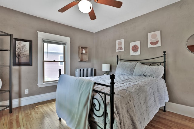 1807 Minnehaha Ave W, Saint Paul, MN 55104 - bedroom featuring hardwood / wood-style flooring, radiator, baseboards, and a ceiling fan