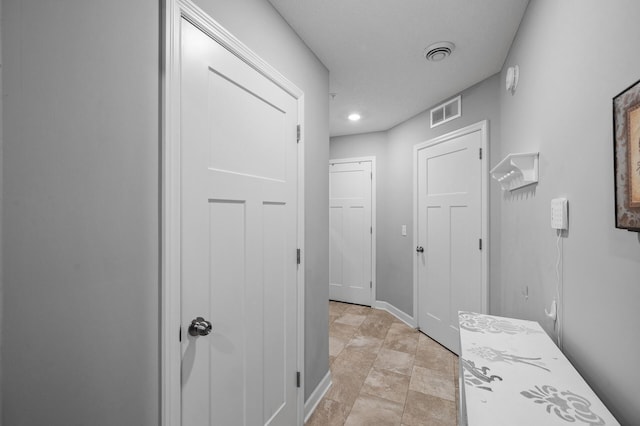 7243 Ada Dr, Lino Lakes, MN 55038 - corridor with recessed lighting, baseboards, and stone finish flooring