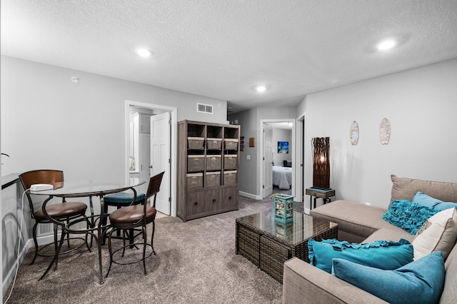 7243 Ada Dr, Lino Lakes, MN 55038 - carpeted living area featuring a textured ceiling, recessed lighting, and baseboards