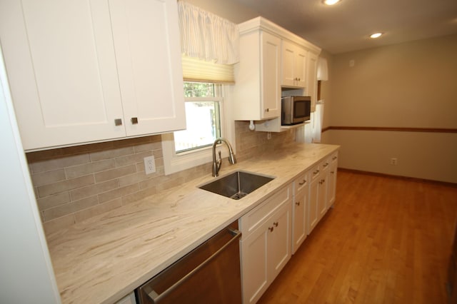 3249 Zane Ave N, Crystal, MN 55422 - kitchen featuring a sink, stainless steel appliances, white cabinets, recessed lighting, and light wood-type flooring