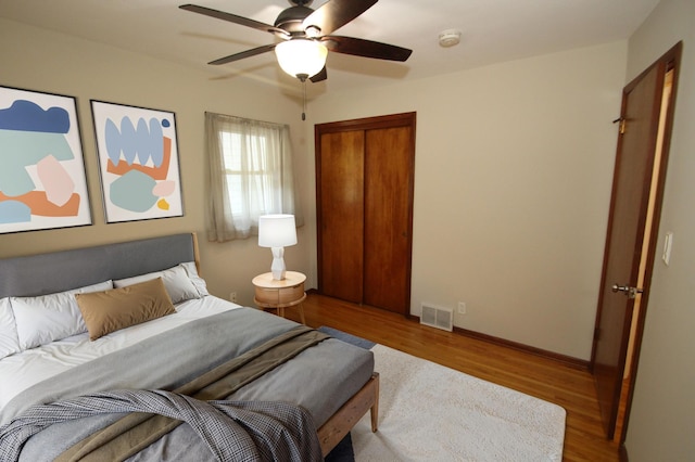 3249 Zane Ave N, Crystal, MN 55422 - bedroom featuring wood finished floors, a ceiling fan, and baseboards