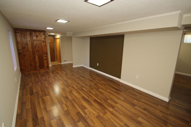 3249 Zane Ave N, Crystal, MN 55422 - finished below grade area with dark wood-type flooring, a textured ceiling, baseboards, and ornamental molding