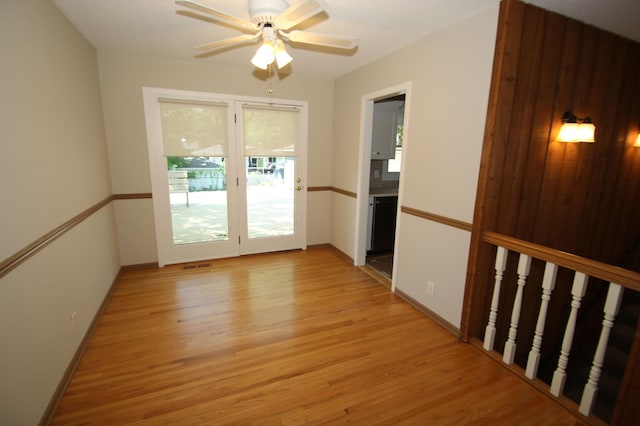 3249 Zane Ave N, Crystal, MN 55422 - spare room featuring light wood-style flooring, a ceiling fan, and baseboards