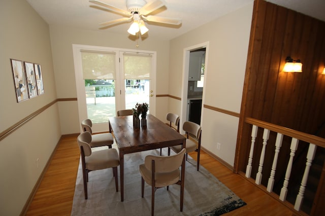3249 Zane Ave N, Crystal, MN 55422 - dining space featuring light wood-style floors, a ceiling fan, and baseboards