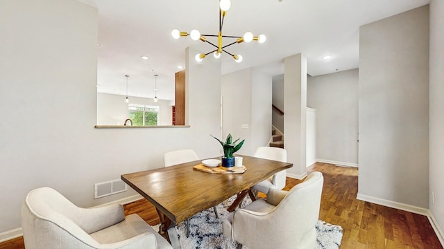 8102 Oakview Ln N Unit 39, Maple Grove, MN 55369 - dining area featuring stairway, a chandelier, baseboards, wood finished floors, and recessed lighting