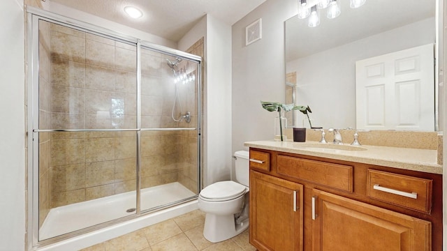 8102 Oakview Ln N Unit 39, Maple Grove, MN 55369 - bathroom with tile patterned floors, toilet, vanity, and a shower stall