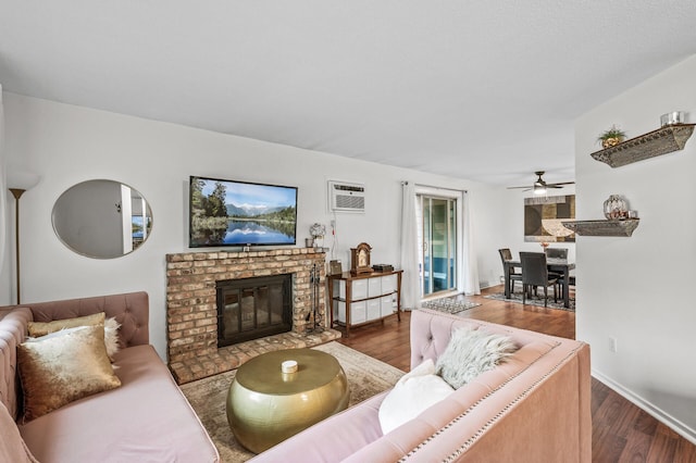 2220 Ridge Dr Unit 16, Saint Louis Park, MN 55416 - living area featuring a ceiling fan, wood finished floors, a fireplace, and a wall mounted AC