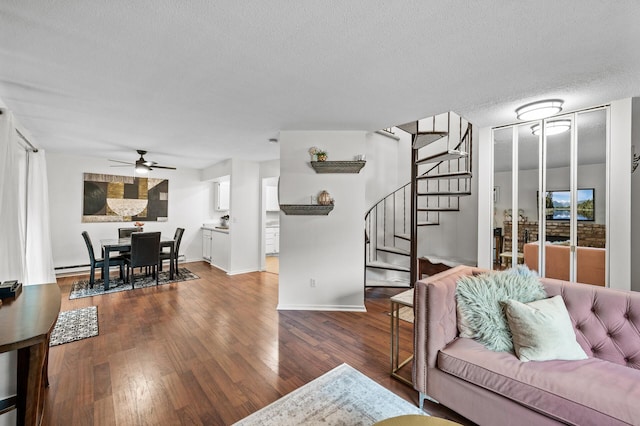 2220 Ridge Dr Unit 16, Saint Louis Park, MN 55416 - living area featuring stairs, ceiling fan, wood finished floors, and a textured ceiling