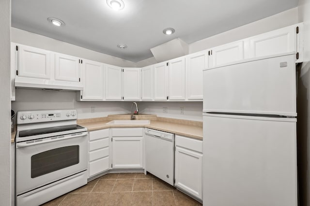 2220 Ridge Dr Unit 16, Saint Louis Park, MN 55416 - kitchen featuring white appliances, light countertops, white cabinetry, under cabinet range hood, and tile patterned flooring