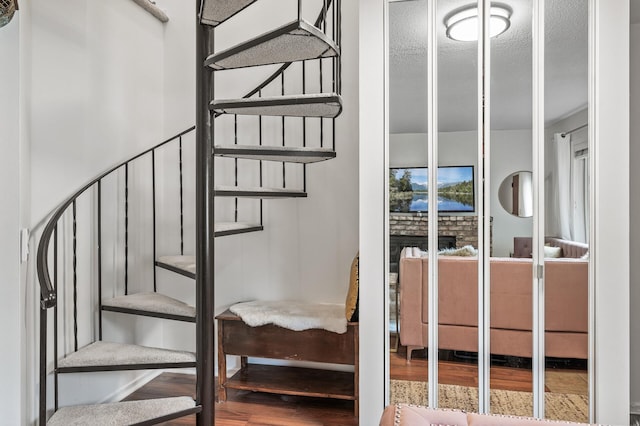 2220 Ridge Dr Unit 16, Saint Louis Park, MN 55416 - staircase with wood finished floors and a textured ceiling