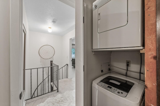 2220 Ridge Dr Unit 16, Saint Louis Park, MN 55416 - laundry room featuring stacked washing machine and dryer and carpet floors