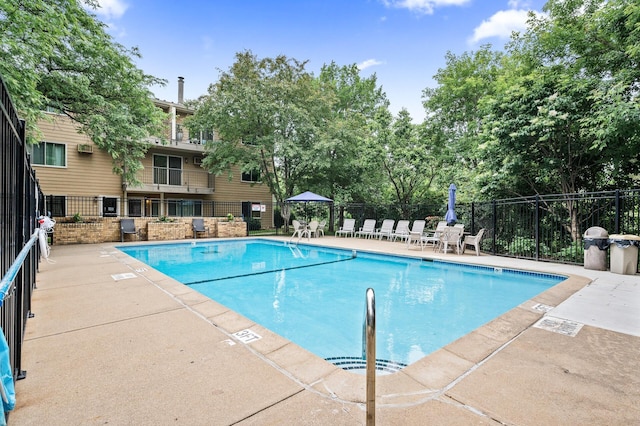 2220 Ridge Dr Unit 16, Saint Louis Park, MN 55416 - community pool featuring a patio area and view of wooded area