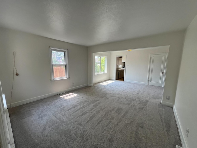 2619 2nd Ave W, Hibbing, MN 55746 - carpeted empty room featuring baseboards