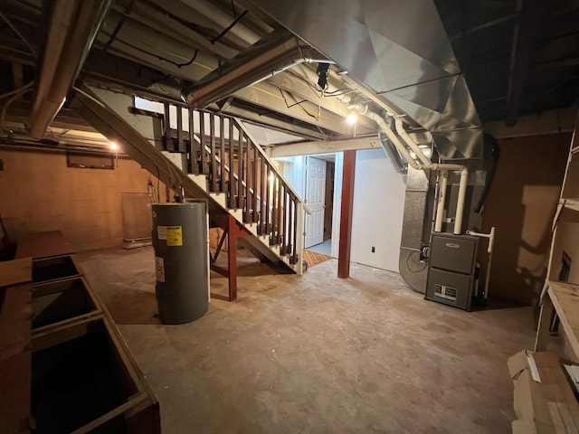 2619 2nd Ave W, Hibbing, MN 55746 - unfinished below grade area featuring water heater, stairway, and heating unit