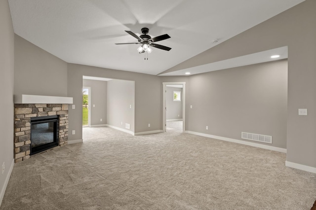 17266 204th Ave NW, Big Lake, MN 55309 - unfurnished living room with carpet floors, lofted ceiling, a ceiling fan, baseboards, and a fireplace