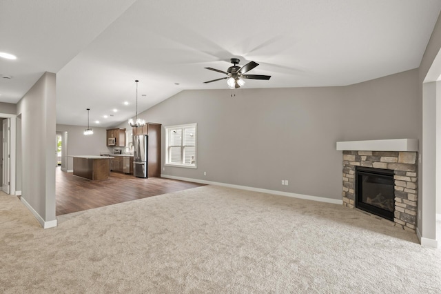 17266 204th Ave NW, Big Lake, MN 55309 - unfurnished living room with carpet, baseboards, ceiling fan, vaulted ceiling, and recessed lighting