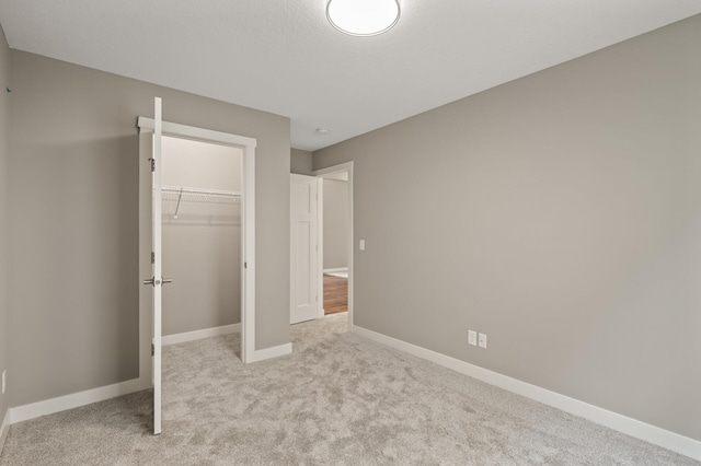 17266 204th Ave NW, Big Lake, MN 55309 - unfurnished bedroom with carpet floors, baseboards, and a closet