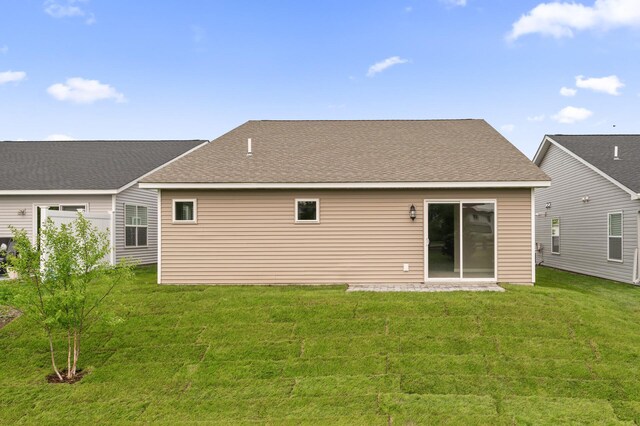 17266 204th Ave NW, Big Lake, MN 55309 - back of house featuring a yard and roof with shingles