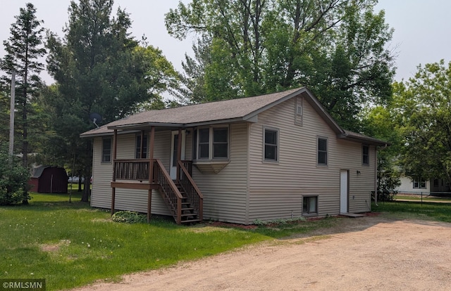 353 44th Ave NW, Powers Twp, MN 56435 - view of front of home featuring a front yard, stairs, and covered porch