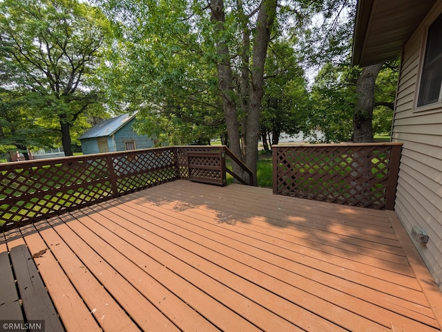 353 44th Ave NW, Powers Twp, MN 56435 - wooden deck featuring view of scattered trees